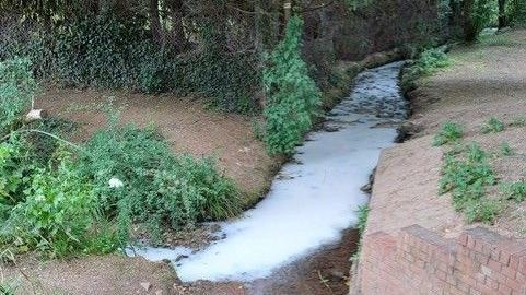 Paint spill blamed for stream turning white