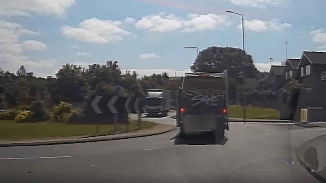 Footage shows van driver ramming police cars