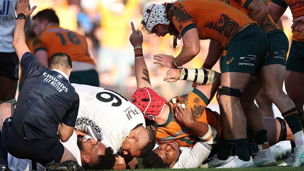 'Massively relieved' Australia score late try to beat Fiji