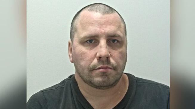 Rapist who set fire to woman's hair jailed