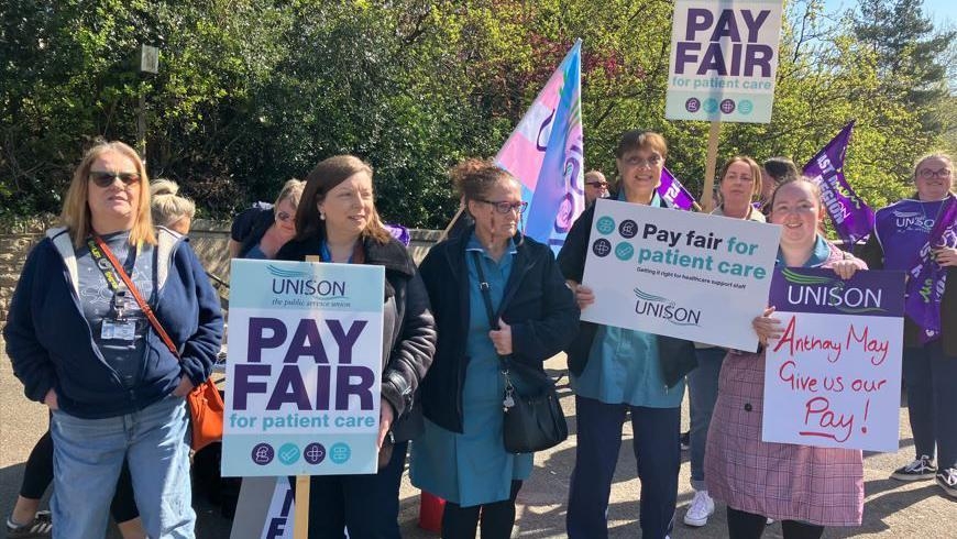 Hospital staff strike in dispute over back pay