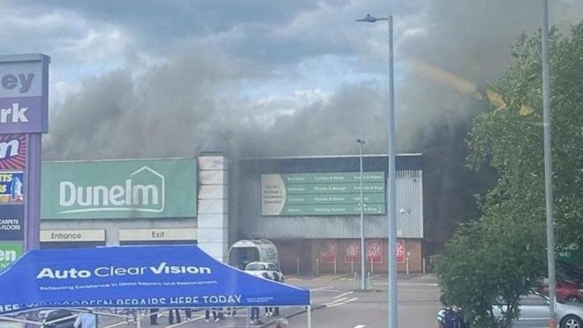 Fourth boy arrested over retail park fire