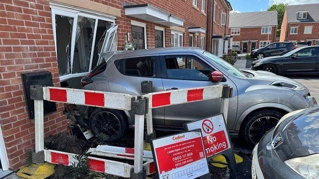 Car 'deliberately reversed' into house many times