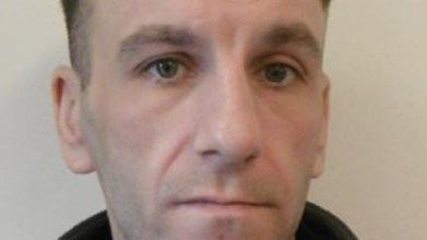 Manhunt for escaped prisoner last seen on train