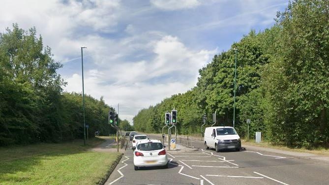 Woman injured in collision involving police vehicle