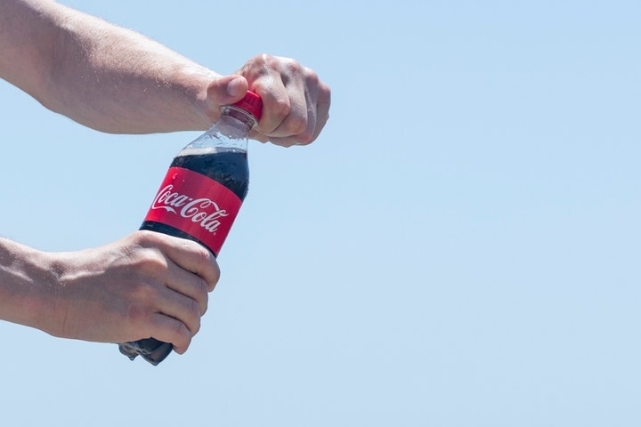 Here's How Much Warren Buffett Pockets Every Time You Buy a Bottle of Coke