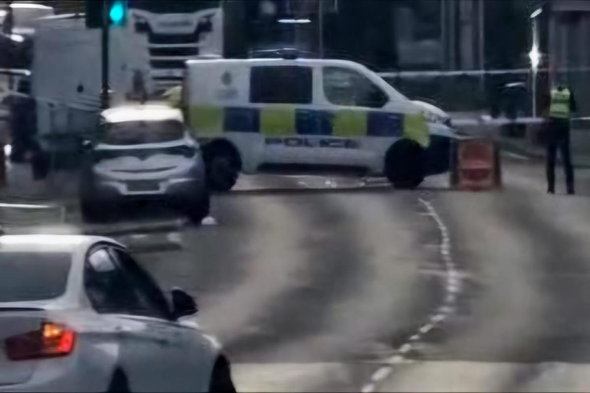 Police scene on major road after man suffers neck injuries in reported assault