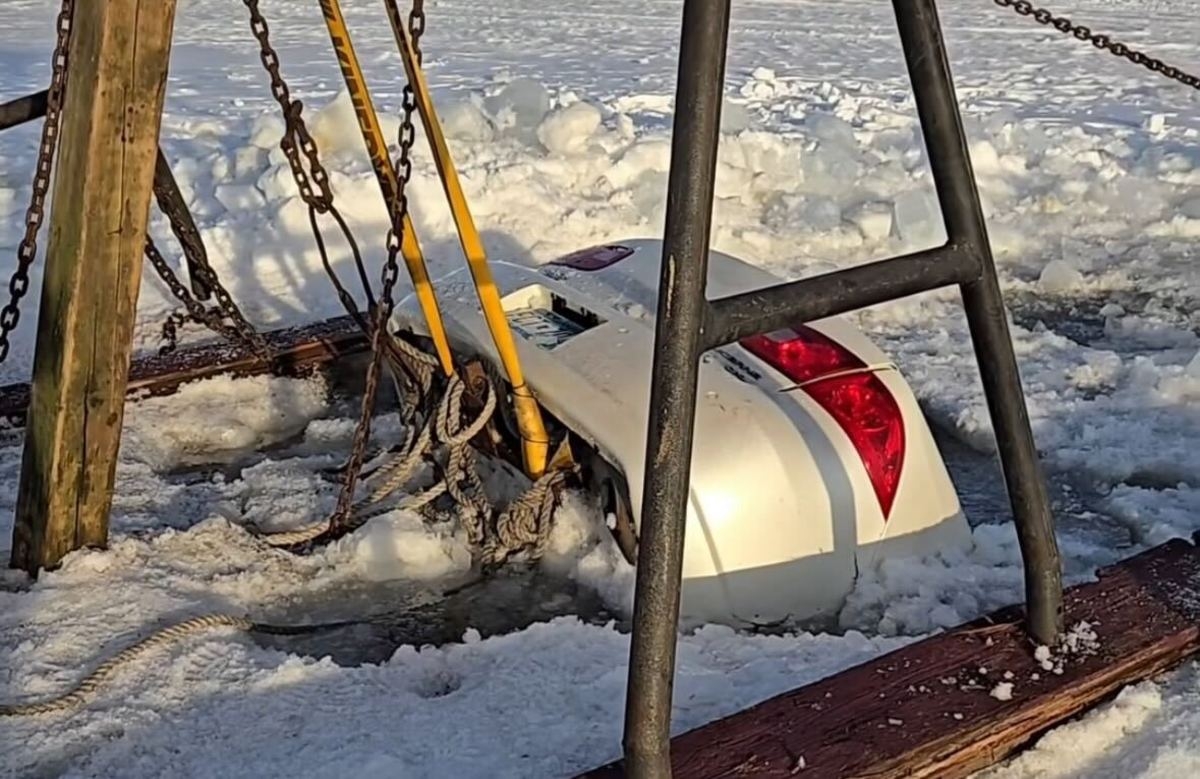 Partially submerged car frozen in Twin Cities lake becomes viral curiosity
