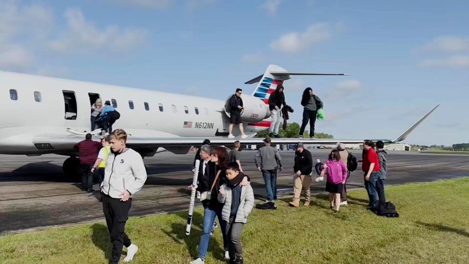 Passengers evacuate American Airlines regional jet after burning odor and smoke reported in cabin