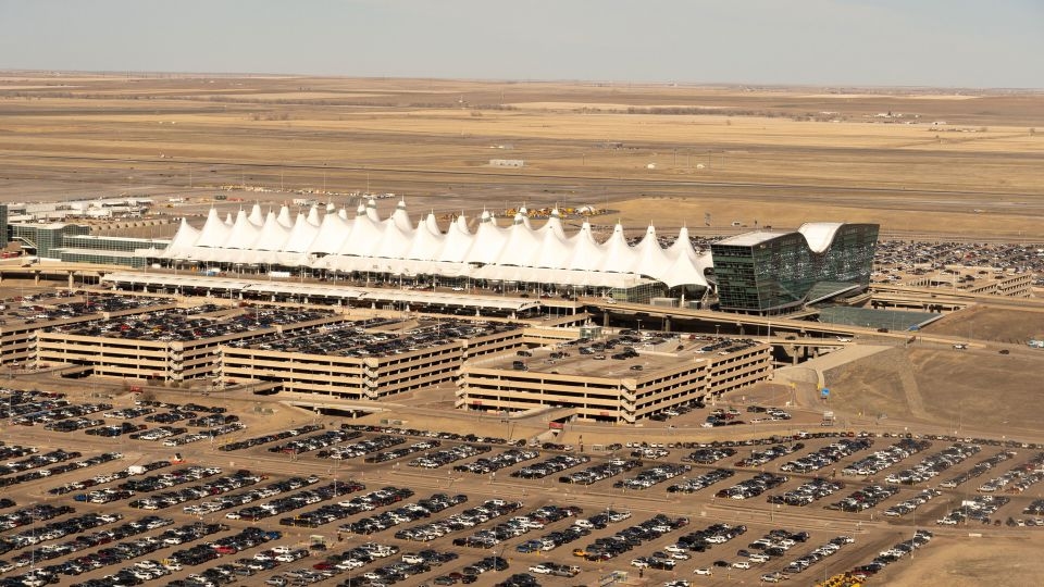 Passengers evacuated from plane onto Denver runway after landing gear issue sparked fire and left 1 injured