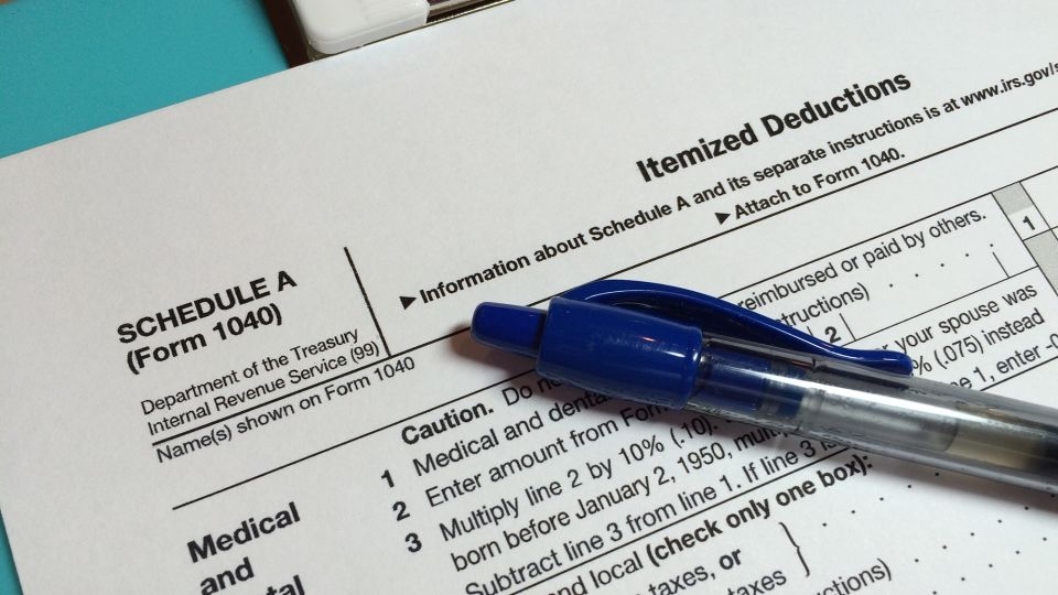 Who benefits most from the state and local tax deduction and why raising the cap is contentious