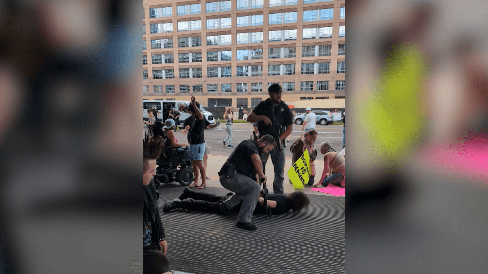 ‘He's right there': Bystander flags man with rifle to police at ‘No Kings' protest
