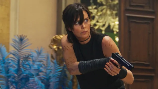 Henry Golding Calls Charlize Theron ‘Female Counterpart' of Tom Cruise