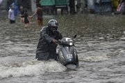 Record rains bring Mumbai to a standstill, in photos