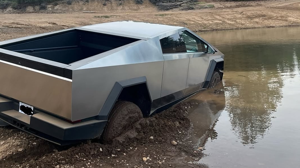 The moment a Tesla Cybertruck owner discovers his car is not the boat Elon Musk said it would be.