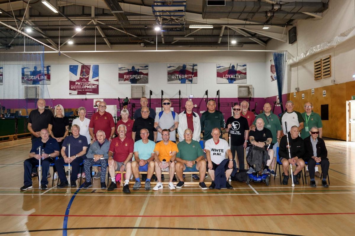 Blind veterans enjoy sports day during summer camp at HMS Sultan