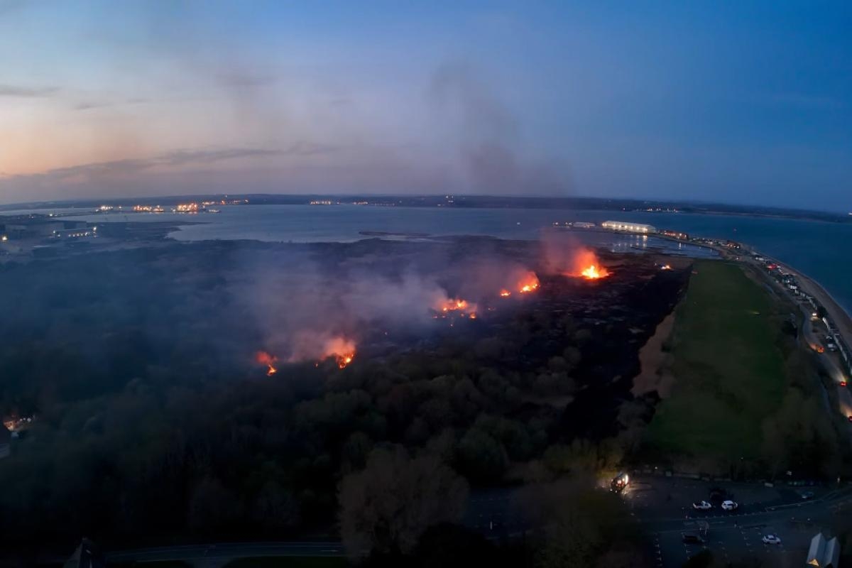 Drone footage and photos show scale of fire ripping through marsh
