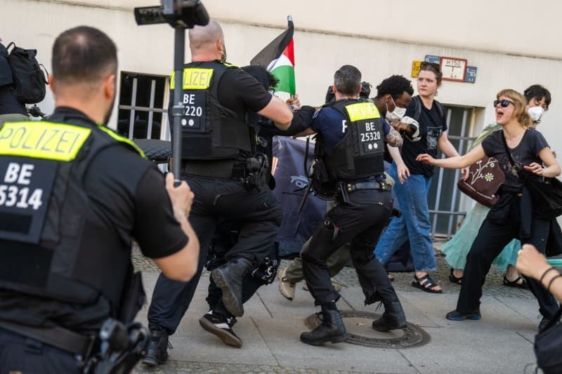 Berlin police clear occupied lecture hall, launch investigations