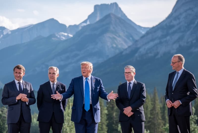 Macron and Trump trade barbs over US president's early G7 exit