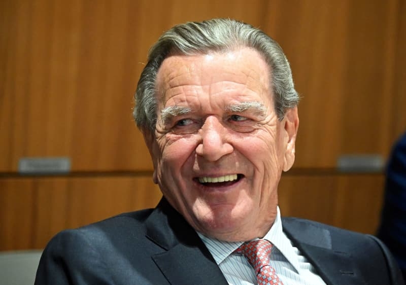 German ex-chancellor Schröder on rare public outing at state vote