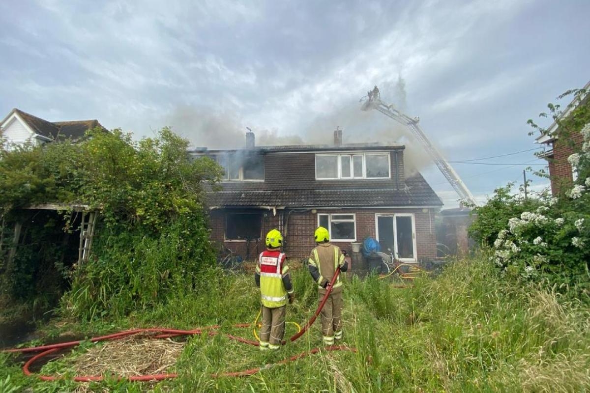 Firefighters bring two-house Essex fire under control as smoke remains