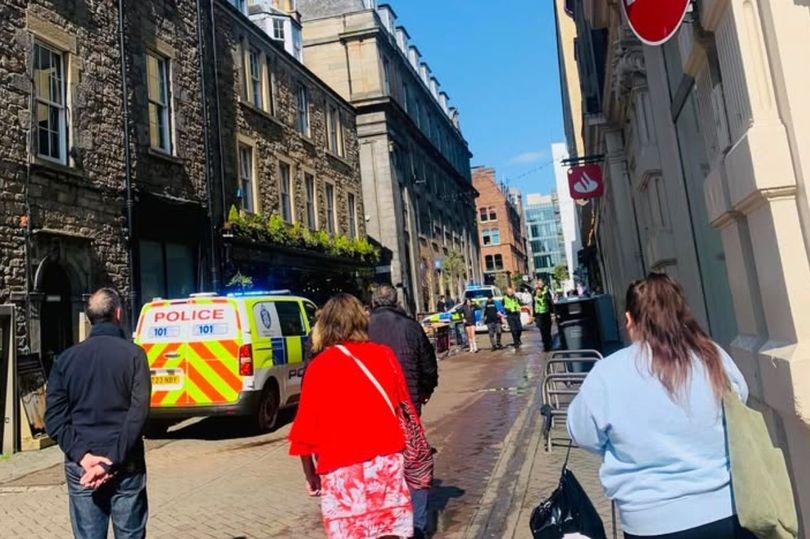 Police swoop on busy Edinburgh city centre street leaving locals baffled