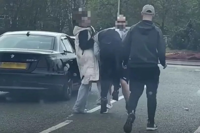 Moment 'road rage' escalates into brawl in middle of the road near Scottish Asda