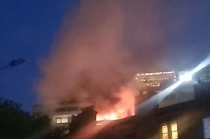 Terrifying moment blaze tears through Edinburgh banana flats as locals watch on