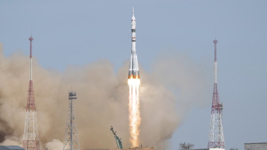 NASA astronaut and Russian crewmates arrive at the International Space Station
