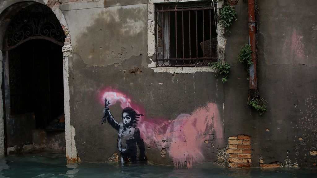 Banksy mural 'The Migrant Child' removed from Venetian palazzo for restoration