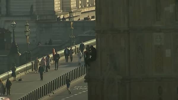 Man scales Big Ben tower at Houses of Parliament holding Palestinian flag