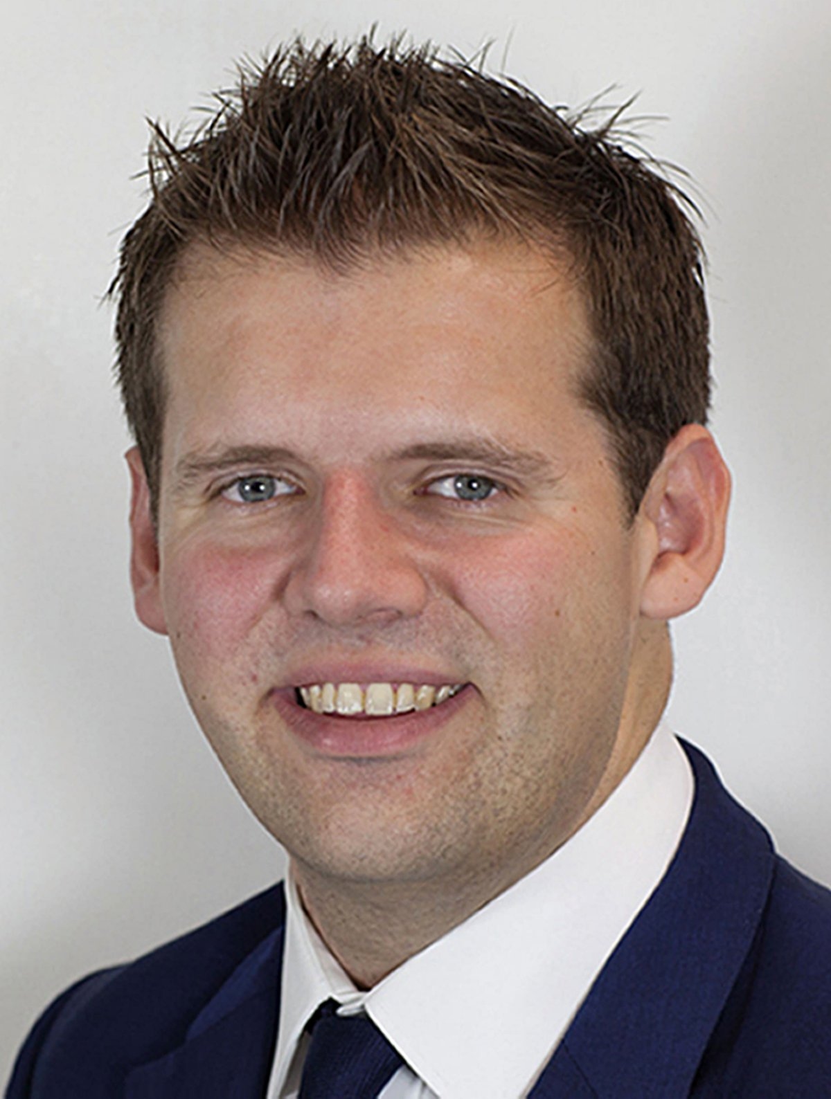 Former MP charged with sexual assault at London pub