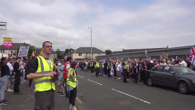 Anti-racism demonstrators stage counter-protest outside asylum seekers hotel_Original Video_m275783.mp4