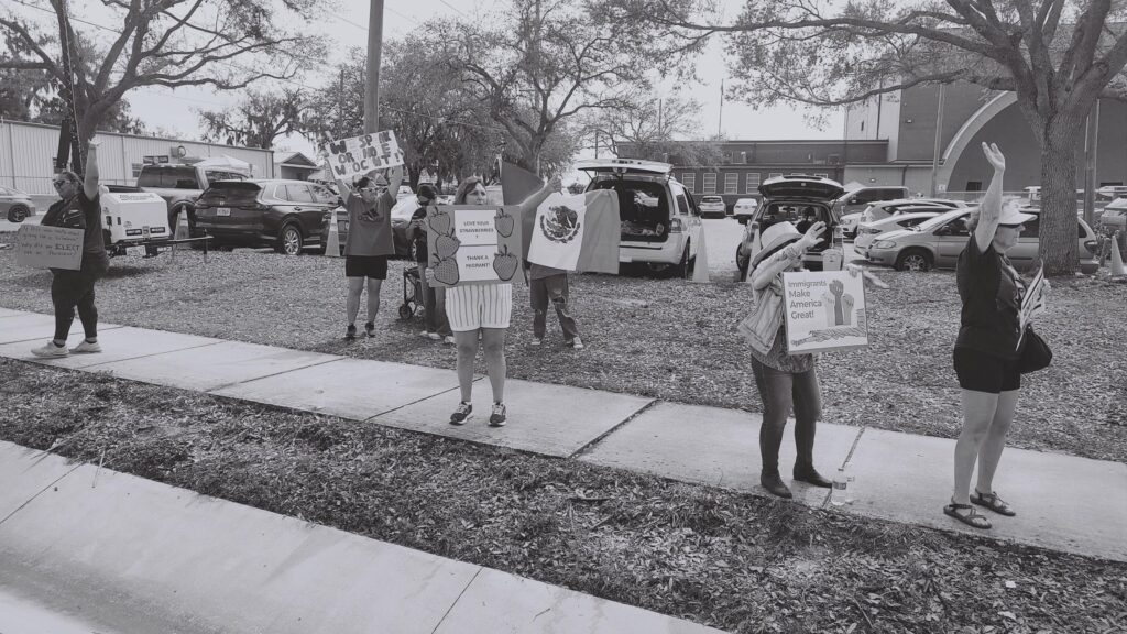 Activists demonstrate for immigrant rights at Florida Strawberry Festival