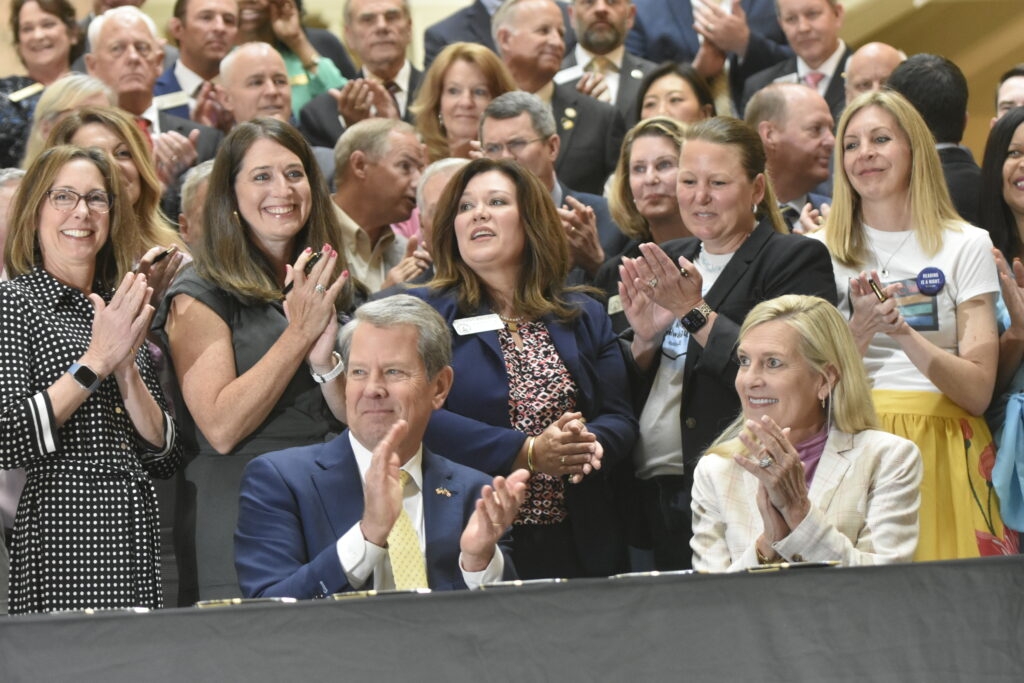 Kemp signs bills requiring school panic buttons, ban on trans girls in Georgia school sports