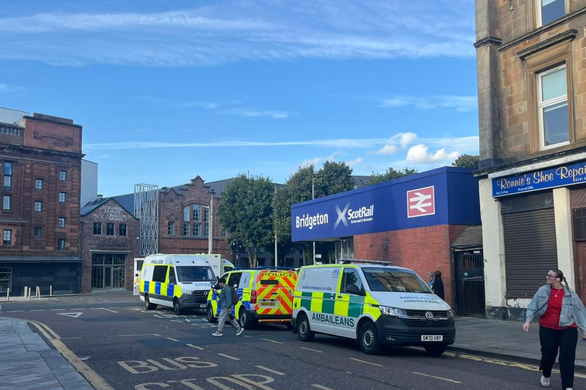Police and paramedics pictured at incident at busy Glasgow train station