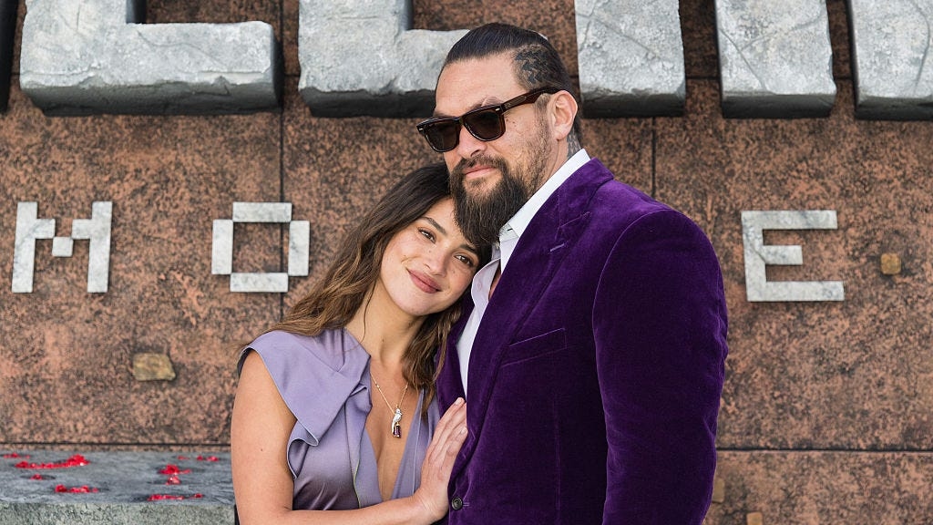Jason Momoa Matched His Scrunchie to Girlfriend Adria Arjona's Lavender Dress