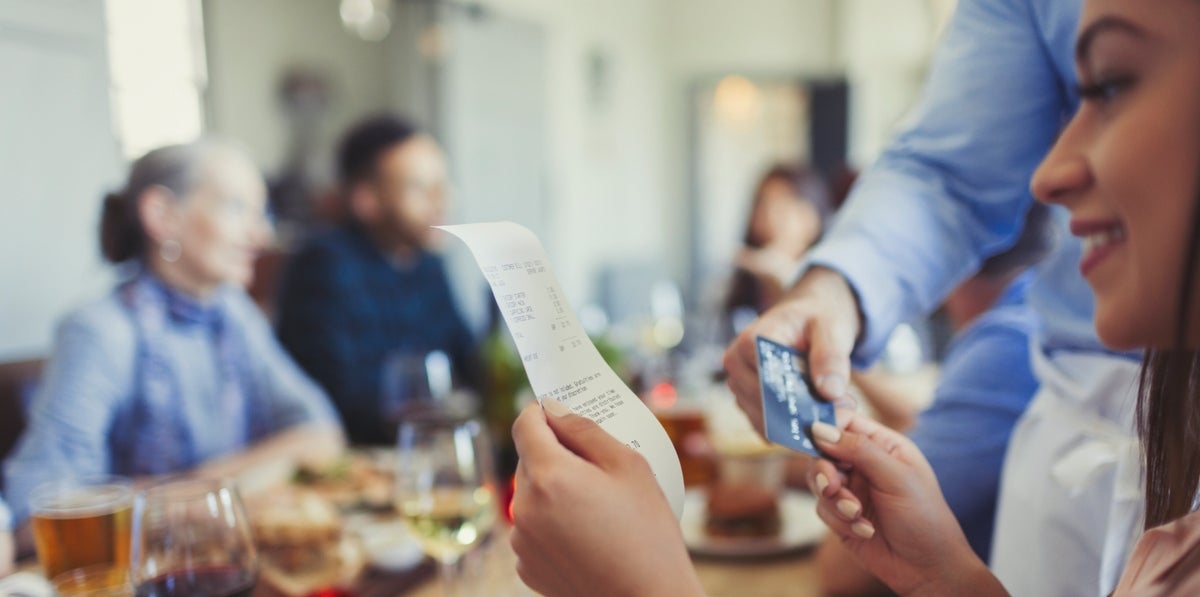 The 1 Thing You Should Always Do After Signing A Restaurant Receipt