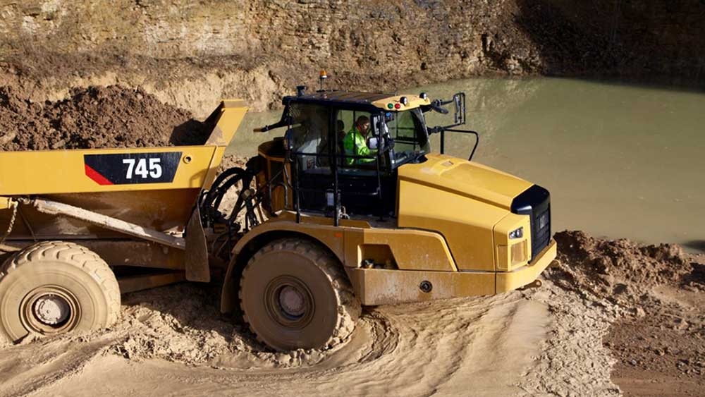 Stock Market Today: Dow Weighed Down By Caterpillar; Nasdaq Holds A Gain, For Now (Live Coverage)