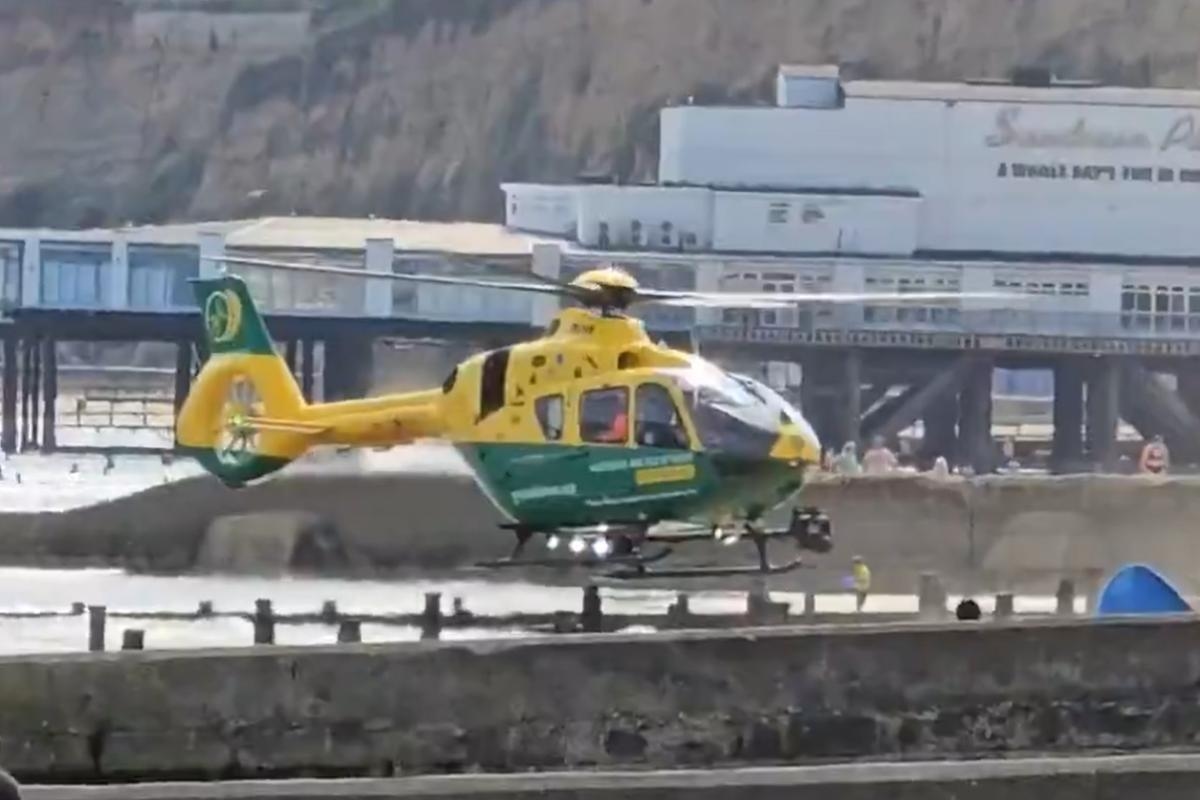 Air ambulance lands on busy beach in Sandown