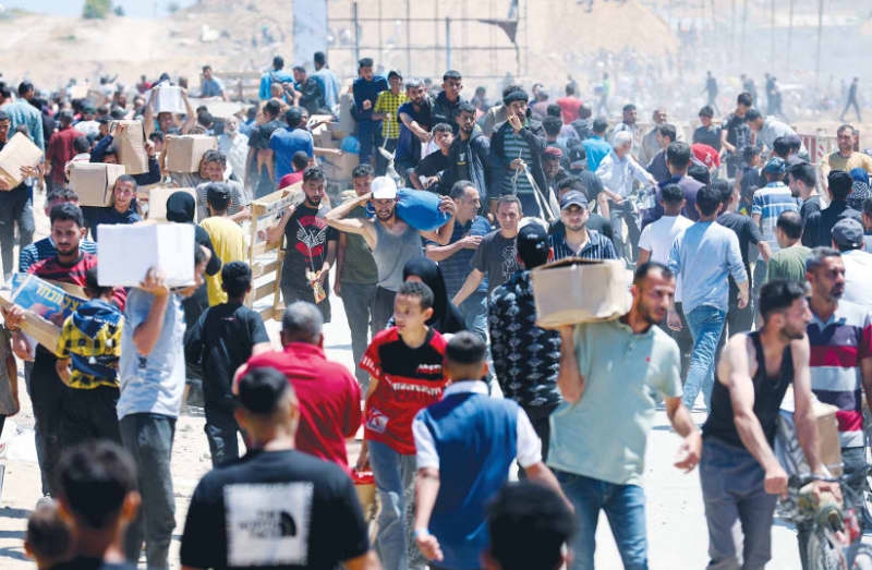 US group distributing aid in Gaza reopens sites after delays