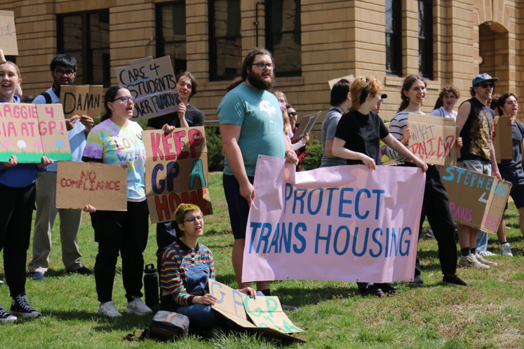 University of Kansas students protest the firing of proctor who spoke about housing policy change