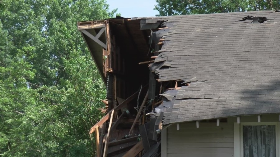 Strong winds in England leave a home nearly split into two, one woman grateful to be alive