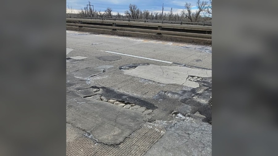 Potholes on I-70 near Deer Trail exposing rebar below