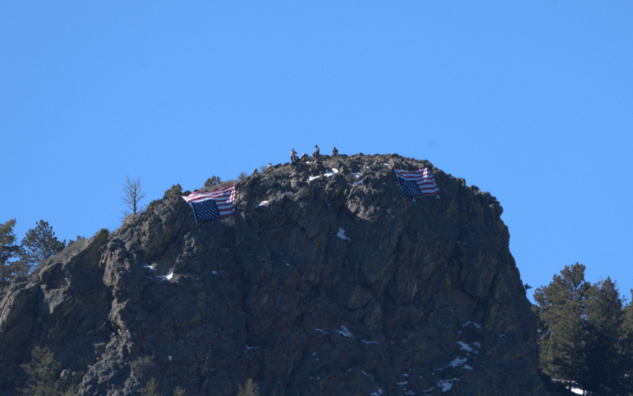 Upside-down American flags hung as hundreds protest US Forest Service cuts at RMNP