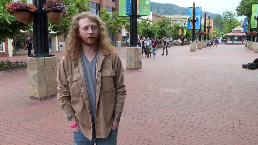 Man helps pour water on victims in Boulder terror attack