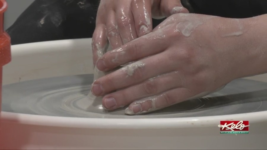 Pottery studio teaching people how to throw it down