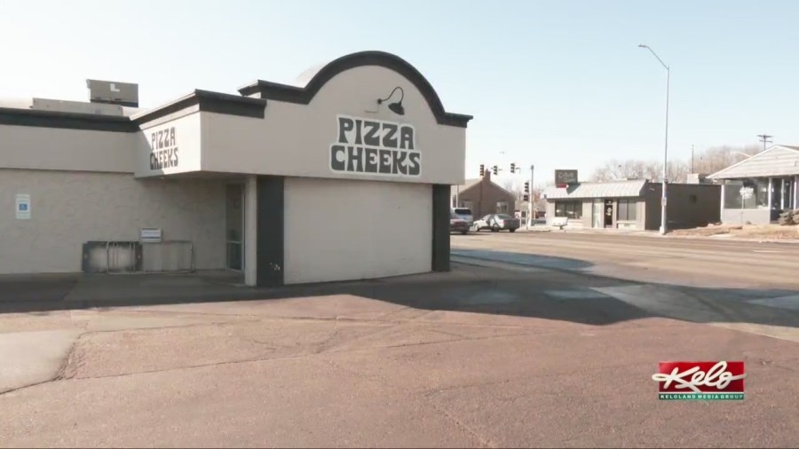 Pizza Cheeks ready to serve a slice at new location