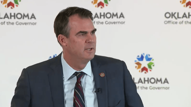 Gov. Stitt warns immigration protestors about violence, protestors say none planned