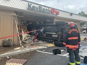 Pickup truck crashes through bank in Spanaway